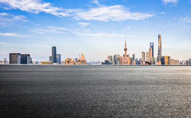 Shanghai city asphalt road and building landscape at sunset