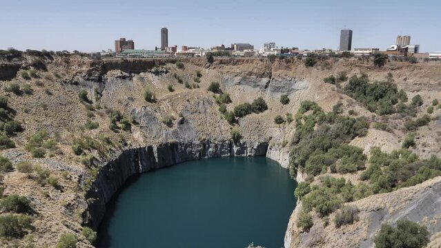 Pan across huge flooded pit of Big Hole diamond mine in South Africa