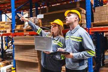 Factory manager, foreman worker checking stock inventory on good shelf in delivery storehouse of logistic storage warehouse, shipping distribution business, package box industry job for retail market