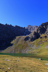 Ailampa lake located on Ak-Suu Traverse trek next to Jyrgalan and Karakol in Kyrgyzstan