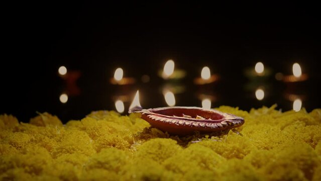 Clay diya lamps lit during diwali celebration, Diwali, or Deepavali, is India's biggest and most important holiday.