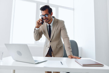 Man computer video call call businessman smile winner phone laptop talk workplace office