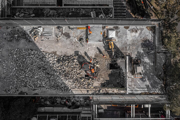 Aerial drone photo of demolition site and construction workers