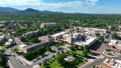 Government buildings in downtown Santa Fe, New Mexico. State Capitol grounds. Aerial establishing shot on summer day.