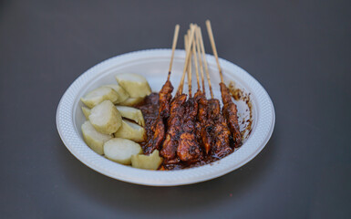 View from the front of Madura Sate on a white plastic plate