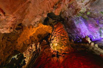 Cave illuminated with yellow and blue lights