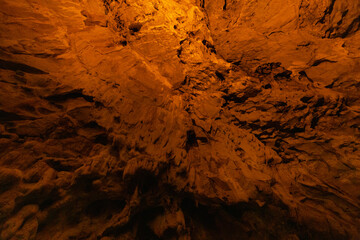 Cave illuminated with orange light