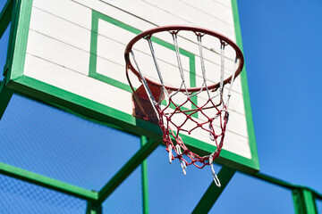 A basketball hoop on a outdoor court