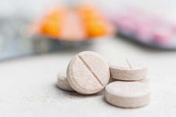 Round pills, medication and tablets in blister pack on a white background, healthcare and medicine concept