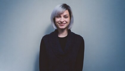 Fototapeta premium Studio portrait of a woman smiling looking at a camera