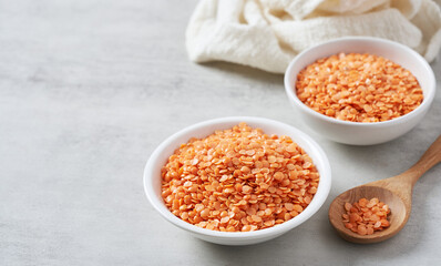 red Lentil seed on white table food background with copy space.