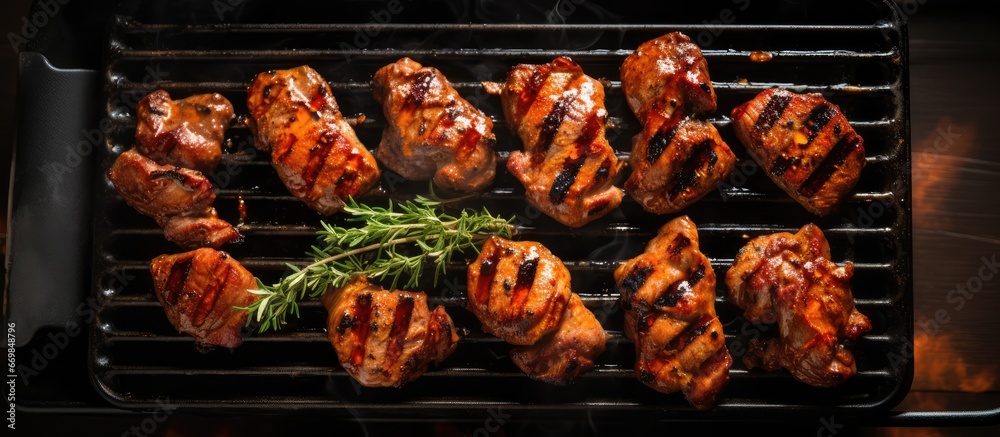 Wall mural grilled meat topped with sauce seen from above