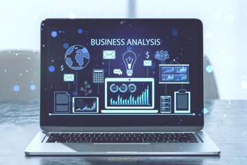 Close up of laptop with financial data and accounting hologram with devices and charts on blue background. Statistic research and technology concept. 3D Rendering.