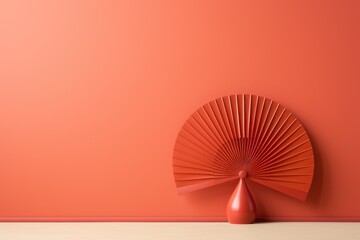 Empty red wall with a figurine in the form of a Chinese fan. Generated by artificial intelligence