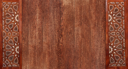 Grunge background with wood texture and ancient carved ornament, Morocco. Horizontal or vertical banner with ornament in Moroccan style. Mock up template