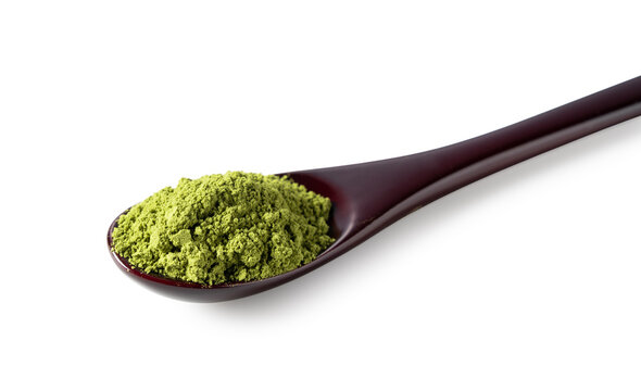 Matcha and wooden spoon on white background.