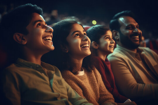 Indian family watching movie in theaters