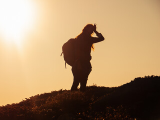 Hike of tourists hiker woman carrying heavy backpack tired during climbing to the top of the...