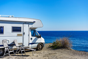 Rv camper camping on sea shore, Spain.