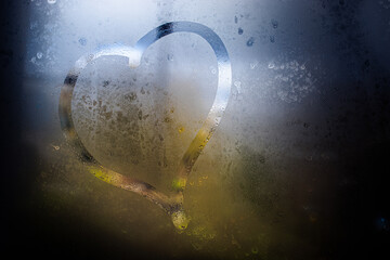 
a heart drawn on glass