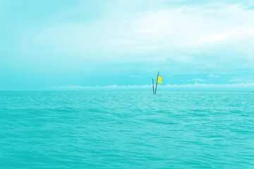 A lonely flag in the sea. Open space. Koh Samui