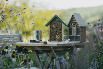 Wooden insect house outdoors in the garden. Bug hotel as home for various species of insects,...