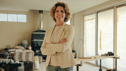 Professional woman overseeing home renovation project with a smile