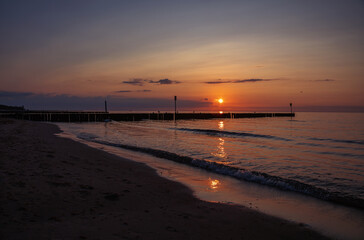 Baltic sea at sunset, city Koloberg in Poland - 669884119