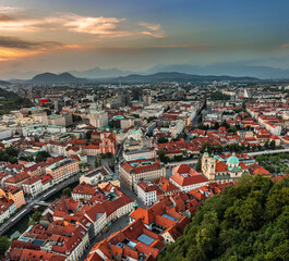 Ljubljana, Slovenia - Aerial panoramic view of Ljubljana on a summer afternoon with Franciscan Church of the Annunciation, Ljubljana Cathedral, skyline of the capital of Slovenia and colorful sunset