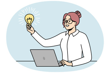 Businesswoman in glasses holds lit light bulb in front of her as symbol of inspiring idea, motivation, source of energy. Talented girl works at computer. Vector minimalistic design isolated on blue.