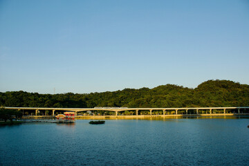 A large lake, mountains, and a scenic view over the lake.