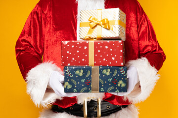 Santa Claus, with gift boxes in his hands.