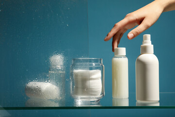 Hygiene products on the shelf in the bathroom
