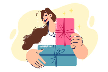 Woman holds gift boxes with bows given for birthdays or christmas and new year holidays