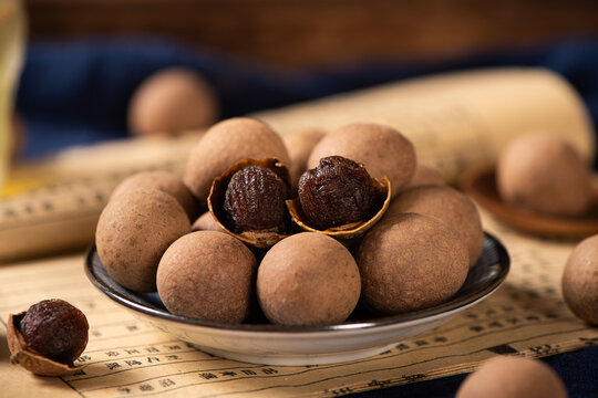 Dried longan on wooden table