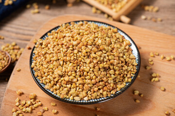 dry buckwheat on wooden background.