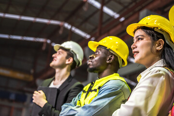 Group diversed engineer man and woman workers working in warehouse