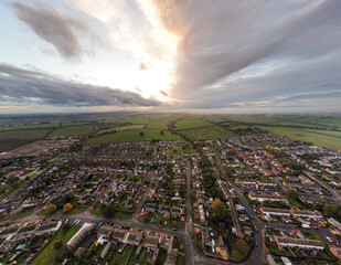 Aerial view 4k small town at sunset in Rutland, UK. 