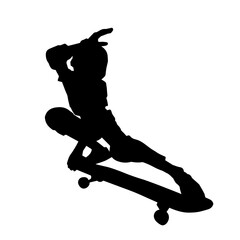 Silhouette of a teenager boy playing skateboard. Silhouette of a male in action pose on skateboard.