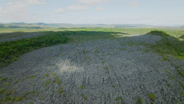 Rock filed with shadow and sun shine through the clouds