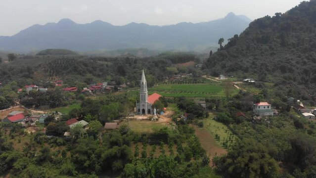 Aerial view of Gi&aacute;o Xứ Bạch Xa Catholic Church With A Greenery Surrounded Farm