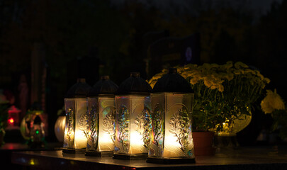 candles on the cemetery on the grave at night, all Saints Day 2