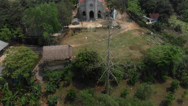 Reveal shot of Gi&aacute;o Xứ Bạch Xa church at Vietnam, aerial