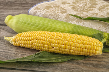 Yellow sweet raw cob corn