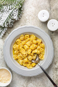 Tortellini in beef and chicken broth. Traditional Italian Christmas main course especially in Bologna. Stuffed with a mix of meat, prosciutto, mortadella, hard cheese, egg and served in capon broth.