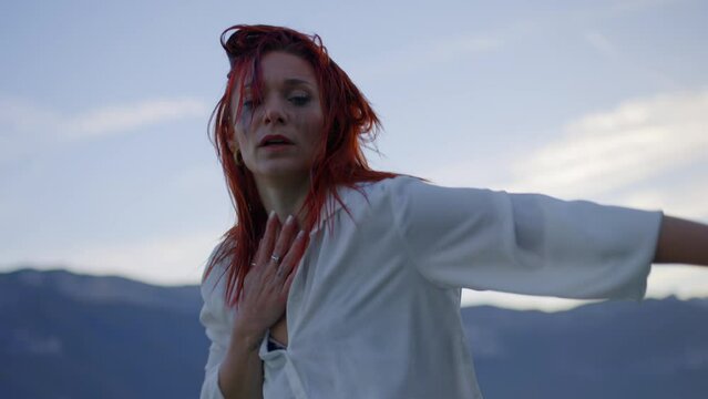 Woman dancing in a lake