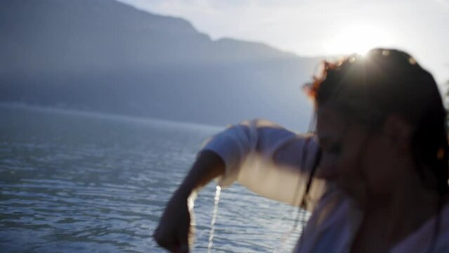 Woman dancing in a lake