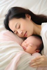 Lovely Asian mother shares moment with child nestled in arms in tender care and warmth. Loving Asian mom holding her baby close in moment filled with tenderness with affection creating memory