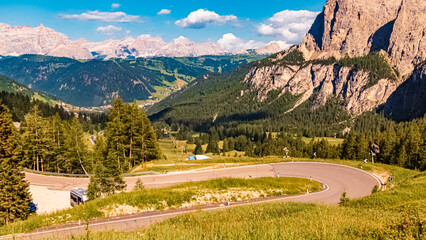 Alpine summer view with a winding road near Passo Gardena, Dolomites, South Tyrol, Italy