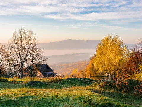 mountainous rural landscape at sunrise in autumn. carpathian countryside scenery in morning light